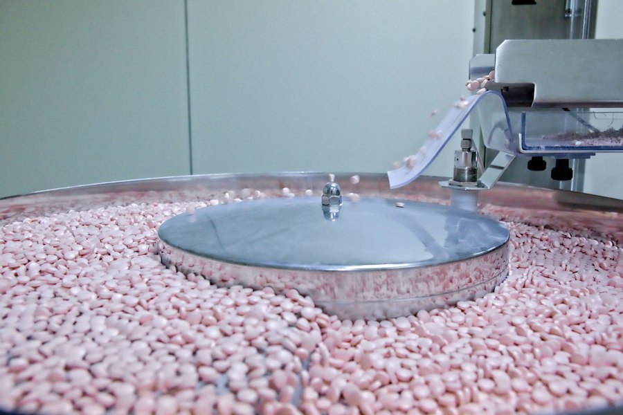 Tablets in a coating machine during production — illustrative image
